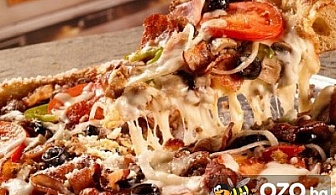 Италианска идилия с огромна и апетитна семейна пица Кон Карне само за 10.90 лв., вместо за 21.80 лв. от Ресторант "Basilico"